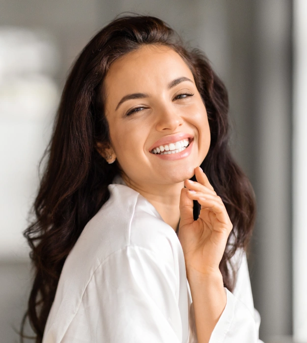 Patient smiling after cosmetic dental treatment